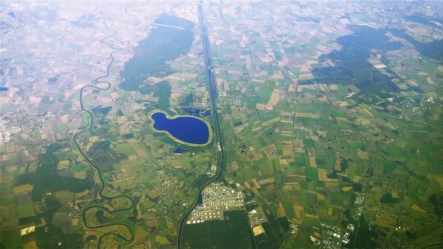 The plane flies over Germany on approaching the Lingen (Ems). Speicherbecken Geeste