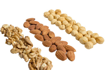 Piles of various nuts (hazelnuts, almonds, walnuts) collection, isolated on white background