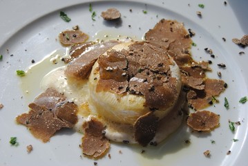 Tomini with truffle (Tomino al Tartufo) in Italy.