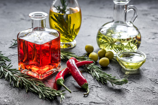 natural oils concept with fresh olives and chili paper on table background
