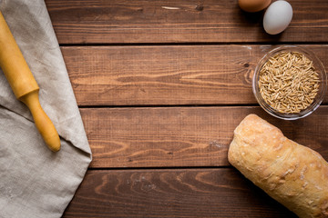 traditional bread with rolling-pin wooden table background top view space for text