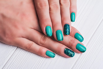 Turquoise nail art with tinsels