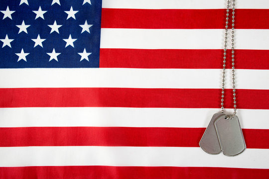 military dog tags on American flag background