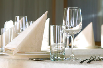 catering table set service with silverware, napkin and glass at restaurant before party