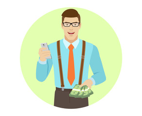 Businessman with mobile phone and cash money