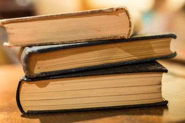 Three old Books in Dim Light