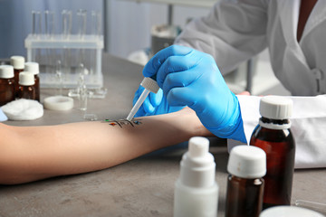 Doctor making allergy test in laboratory