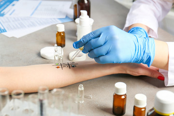 Doctor making allergy test in laboratory