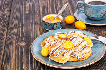 Pancakes with chocolate and kumquats