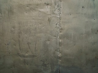 Tin wall background. Old metal texture.Metal plate with rivets