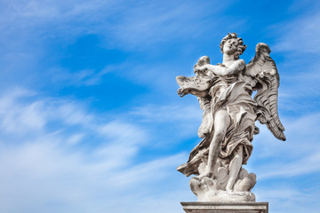 Fototapeta na wymiar Angel statue along Sant'Angelo bridge in Rome. the bridge leading to Rome Castel Sant'Angelo is adorned with ten beautiful Baroque statues of angels