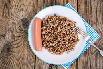 Sausage with garnish of buckwheat
