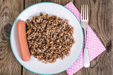 Sausage with garnish of buckwheat