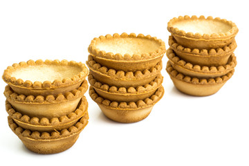 Tartlets empty on white background