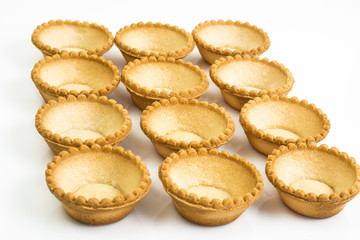 Tartlets empty on white background