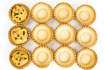 Tartlets empty on white background