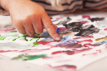 Fototapeta premium little girl learning to paint (child development in art)