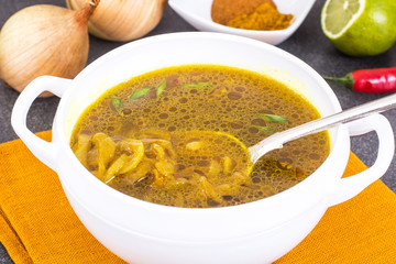 Spicy onion Indian soup with curry