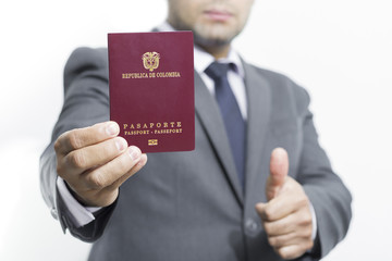 Businessman holding Colombian passport