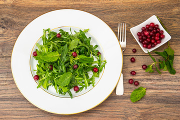 Vegetarian salad of arugula, mint, berries