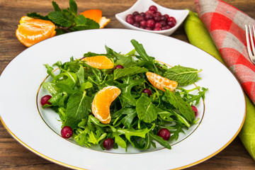 Vegetarian salad of arugula, mint, berries