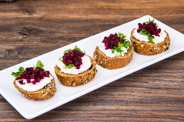 Bruschetta with cheese and beet