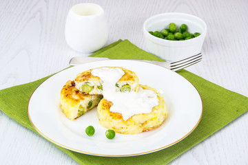 Cheese fritters with green peas