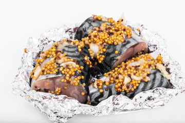 Mackerel in mustard sauce in foil for baking