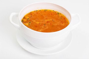Spicy soup with tomatoes and curry on a white background