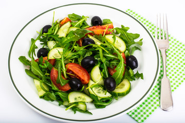 Mediterranean dishes, fresh salad with olives