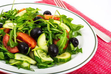 Mediterranean dishes, fresh salad with olives