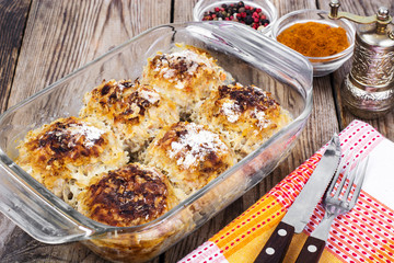 Baked meatballs with rice and vegetables in glass form