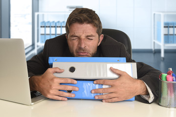 frustrated businessman desperate face expression suffering stress at office computer desk