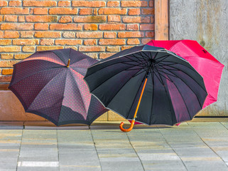 Colorful umbrellas are dried in the walls of the house on the island of Burano - Venice, Italy