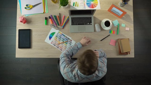Top view of ordinary busy day from life of design studio worker, timelapse