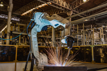 robot is welding in car factory