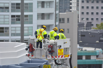 Firefighters exercise on a fire engine ladder