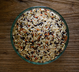 Brown rice seed in bowl. Top view.