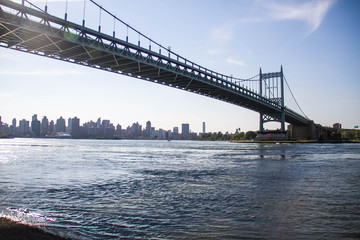 Triborough bridge over the river and Manhattan city, New York