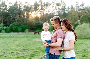 Fototapeta premium Happy family walking outdoor