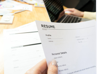 Young woman submit resume to employer to review job application