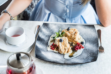 woman eating dessert