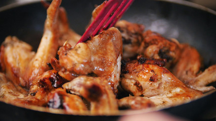 Home junk food - Frying Chicken wings preparing in boiling oil