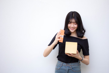 Portrait of thai vietnam teen beautiful girl hold gift box in hands