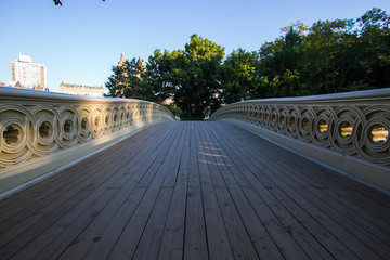 Wooden walkway of Bow bridge at Central Park