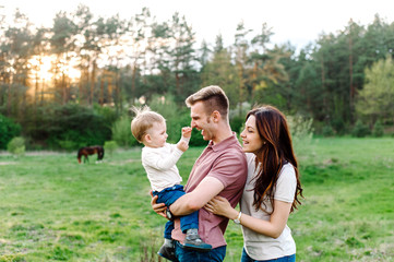 Fototapeta premium Happy family walking outdoor