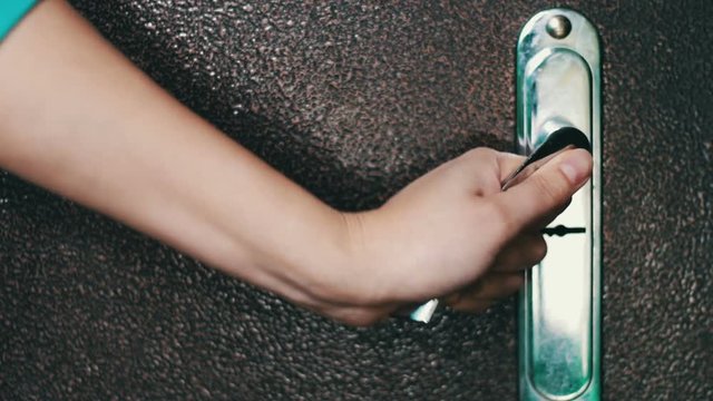 Women hand open door knob or opening the door.