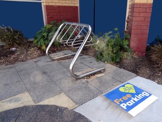 A bicycle located adjacent to a shopping center in Western Australia which allows free parking