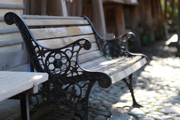 A sight of a park bench on a sunny day