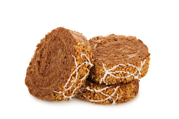 Slices of sweet chocolate roll cake isolated on white